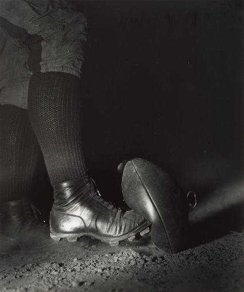 Wes Fesler Kicking a Football