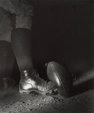 Wes Fesler Kicking a Football