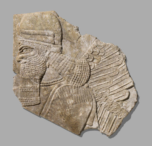 Fragment of a Stone Relief Depicting a Winged Genie