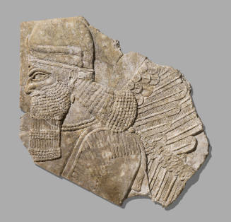 Fragment of a Stone Relief Depicting a Winged Genie