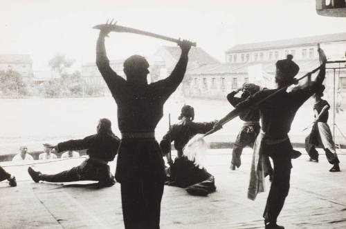 Prisoners Rehearse a Traditional Dance in the Couryard of the Pekin Prison (China)