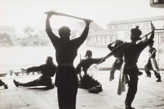 Prisoners Rehearse a Traditional Dance in the Couryard of the Pekin Prison (China)