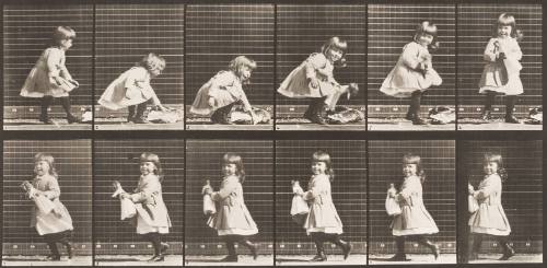 Child Lifting a Doll, Turning and Walking Off