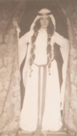 Woman in Medieval Costume Standing Between Curtains