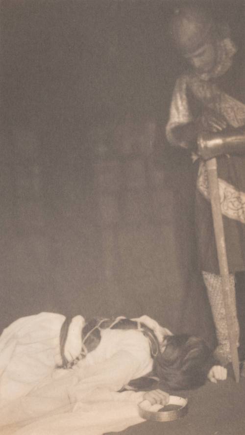 Woman Lying Face Down on Floor, Man in Knight Costume Standing at Right