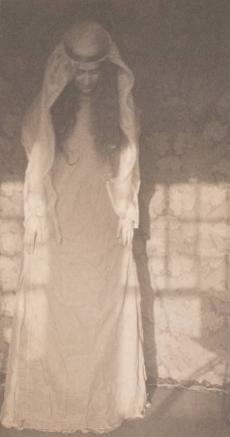 Woman in Medieval Costume Standing With Head Bowed