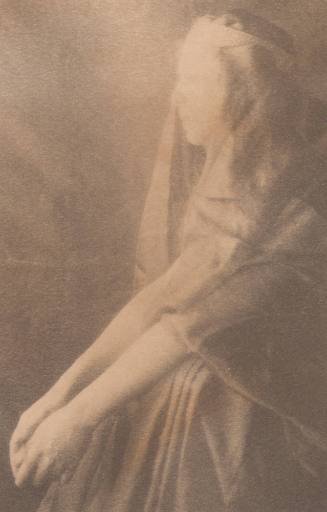 Seated Woman With Medieval Headdress Facing Left, Elbows on Knees, Arms Extended