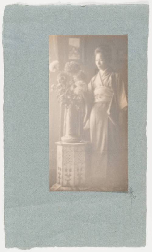 Japanese Woman Admiring Flowers