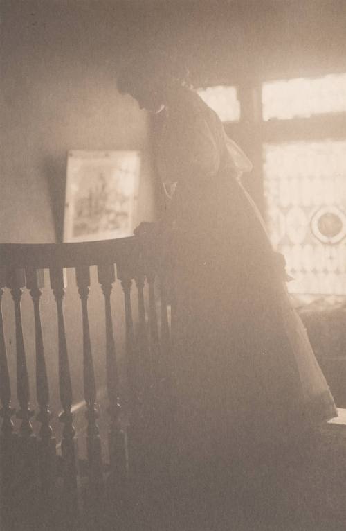 Woman Looking Over Balcony