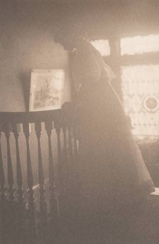 Woman Looking Over Balcony