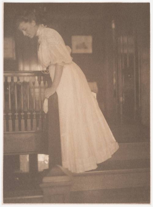 Woman Leaning Over Balcony