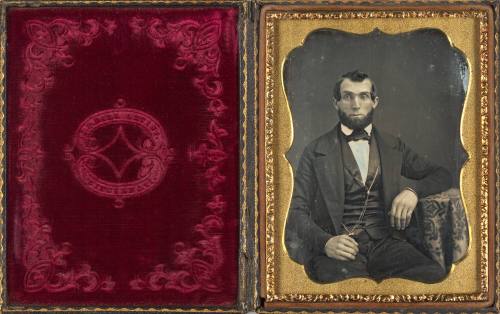 Seated Man Wearing Watch Chain