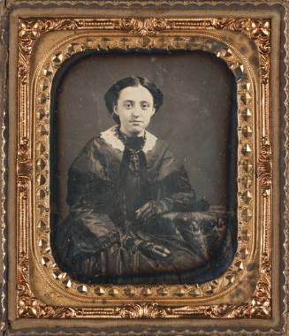 Seated Woman Wearing Gloves