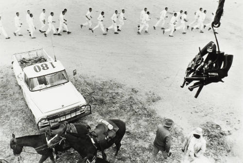 Guns are Passed to the Picket Tower; The Line Returns from Work