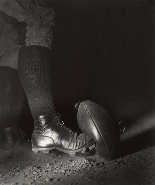Wes Fesler Kicking a Football