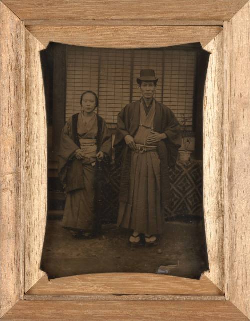 Portrait of a Man and Woman Standing Before a Screen