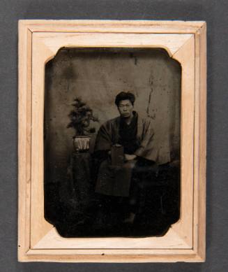 Portrait of a Young Man with Bonsai and Book