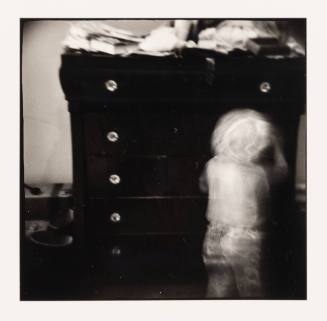 Child and Chest of Drawers