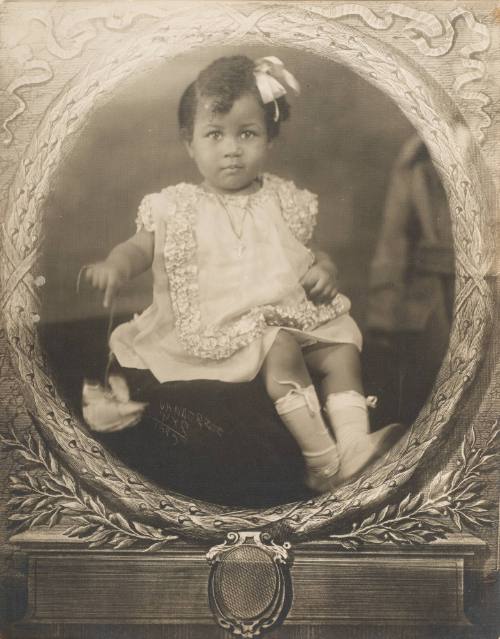 A Girl Holding a Flower, New York