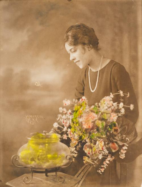 Lady at Goldfish Bowl, New York