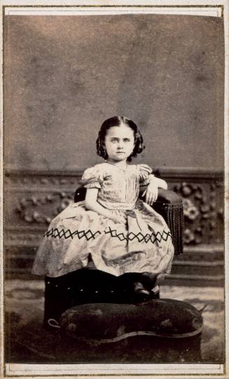 Seated Girl with Diamond Pattern on Skirt