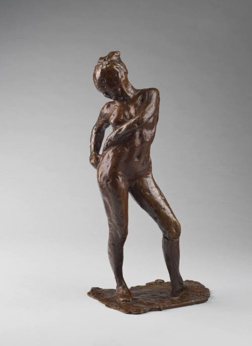 Dancer Fastening the String of her Tights