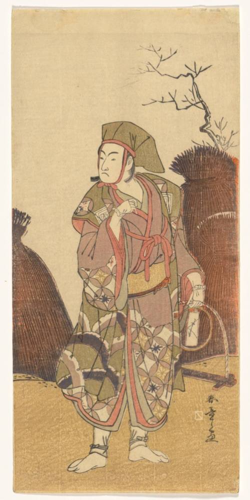 The kabuki actor, Ichikawa Yaozō III, as a Mouse Catcher as he holds a Mousetrap to catch a Fox