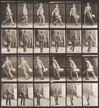 Walking and Turning around Rapidly with a Satchel in One Hand, a Cane the other